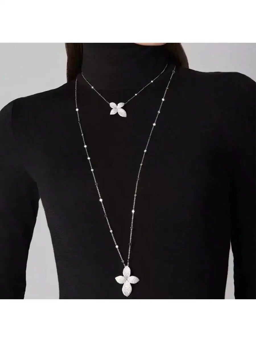 A petal pendant necklace, layered with double layered rhinestones, exuding a sophisticated banquet accessory for women