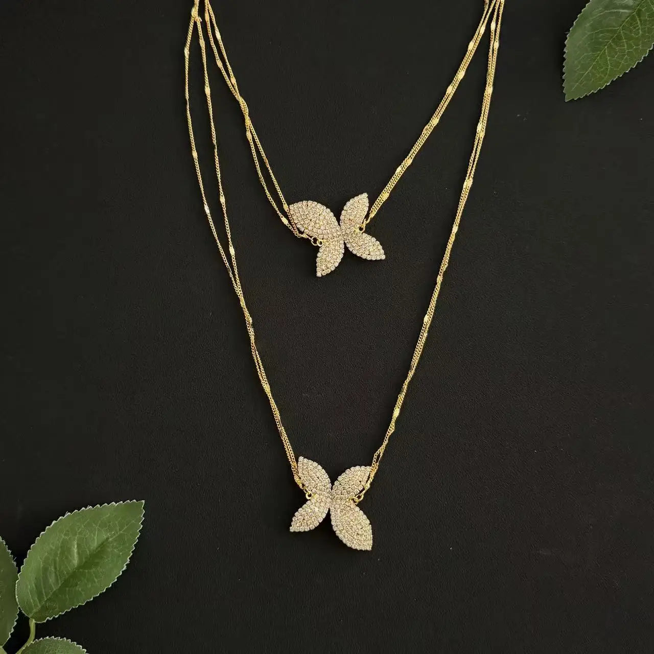 A petal pendant necklace, layered with double layered rhinestones, exuding a sophisticated banquet accessory for women