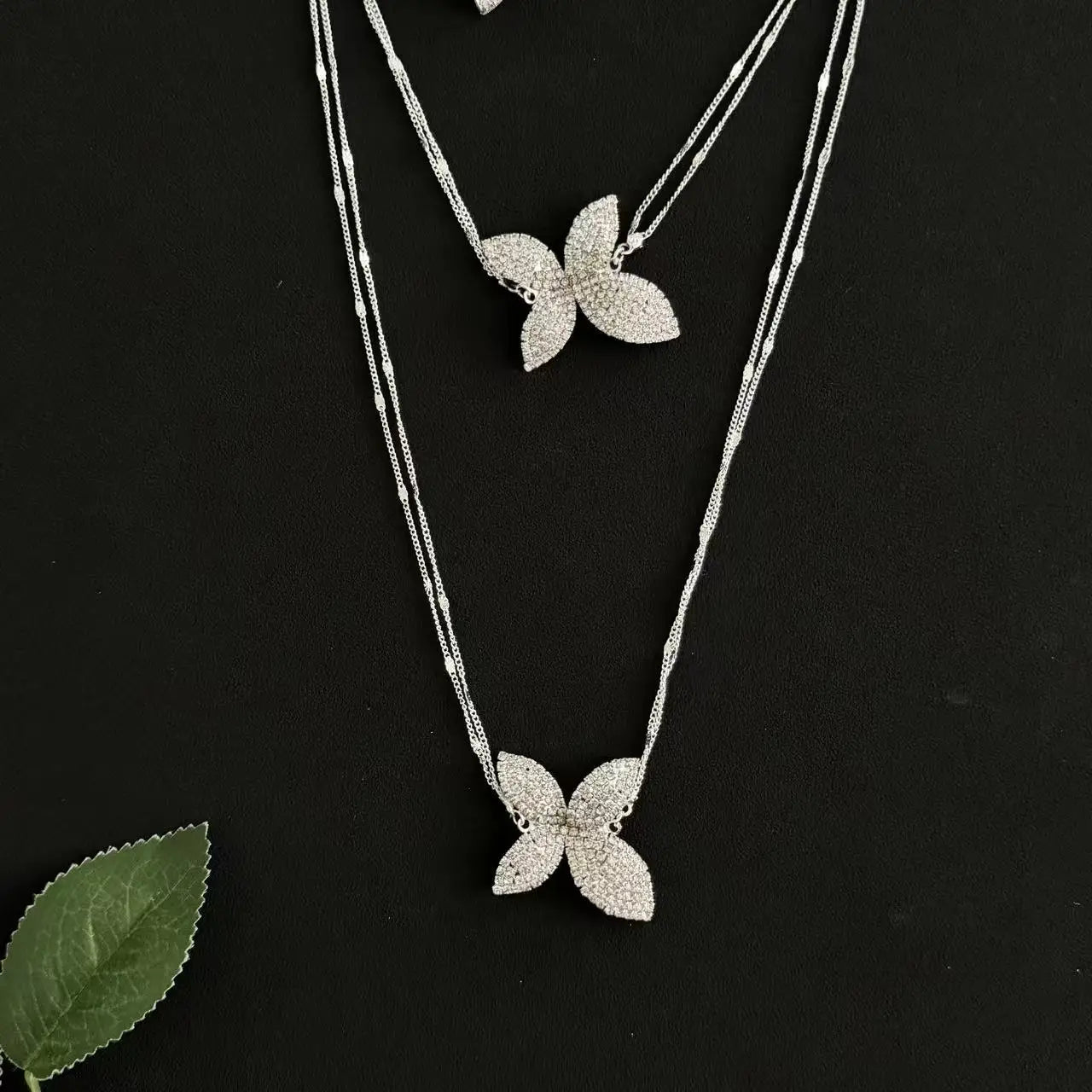 A petal pendant necklace, layered with double layered rhinestones, exuding a sophisticated banquet accessory for women