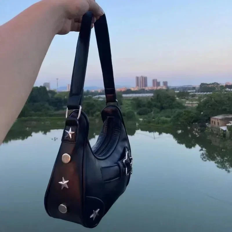 The New 2025 Baguette Bag for Women Is A Trendy Underarm Bag Made of Pu Leather with A Unique Star-shaped Buckle
